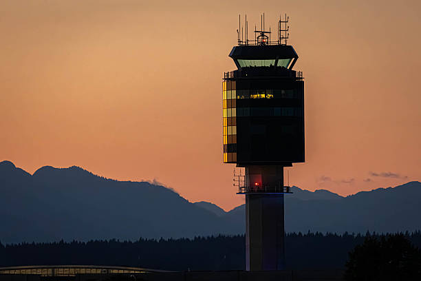 istock Air Traffic Control Tower at Sunset with Mountains in the Background 2232258138