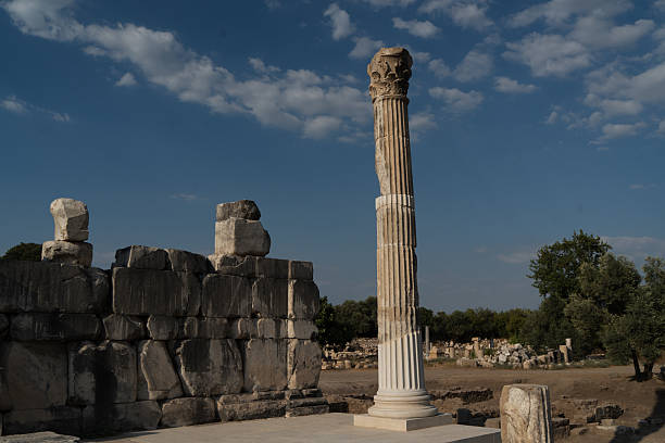 Muğla, Turkey - August 26, 2025: Stratonikeia, located in the Eskihisar Quarter 7 km west of Yatağan District, is one of the largest marble cities of the ancient world. The site preserves layers of history from the Hittites, Archaic and Classical periods, Khrysaoris, Idrias and Hekatesia, to the Hellenistic, Roman, Byzantine, and Turkish Principalities. Today, the ancient city is a popular destination for tourists exploring its monumental gates, colonnaded streets, theaters, and well-preserved structures. An evening view from Stratonikeia reflects both its archaeological significance and its role as a cultural heritage site attracting visitors from around the world.