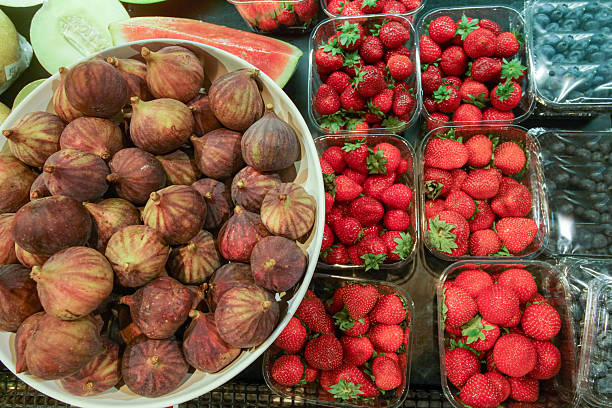 Melon, watetmelon, pattaya,  and fresh figs and strawberries in German food  store  and blueberries