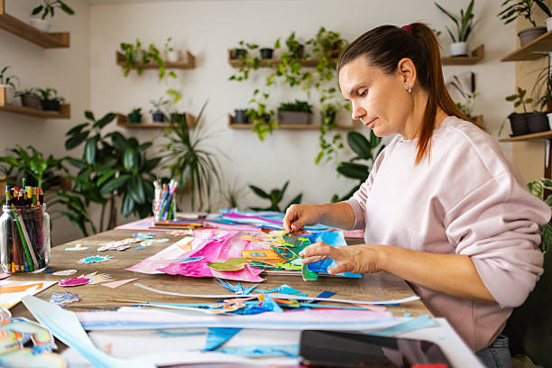 istock Side view of a woman creating collage art 2232259807