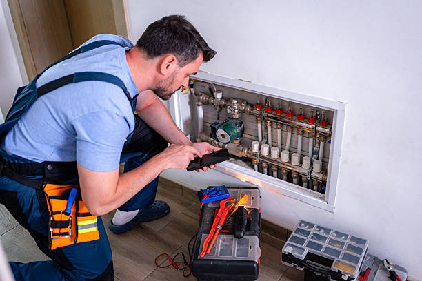 istock Handyman repairing heating system in household during daytime 2232260601
