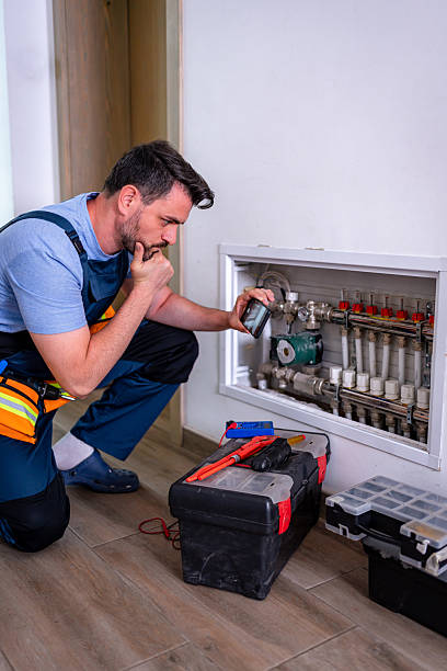 istock Handyman inspecting heating system components for household repair and warranty issues 2232260606