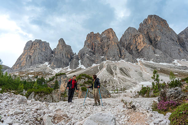 Hikers in the Alps in the Puez-Odle Nature Park in South Tyrol