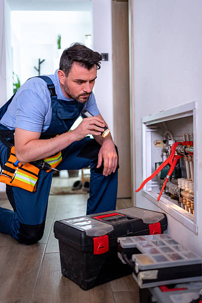 istock Handyman inspecting heating system in a household repair project during daylight hours 2232261718