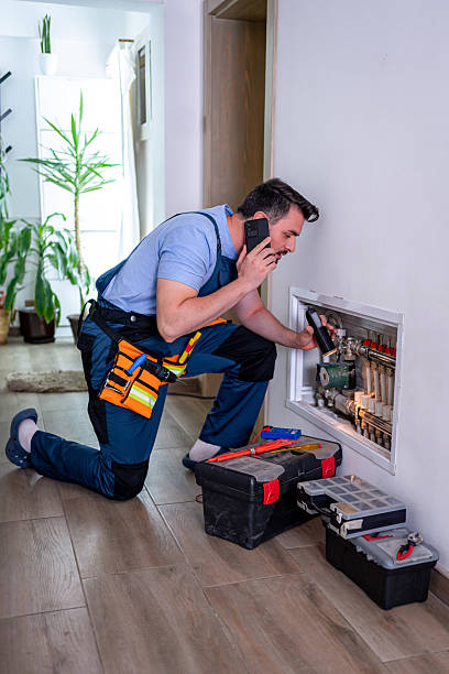 istock Handyman working on heating system repair in a modern household during daylight hours 2232261755