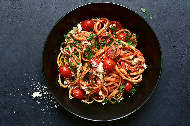 istock Pasta with grilled tomatoes. Top view with copy space. 2232267023