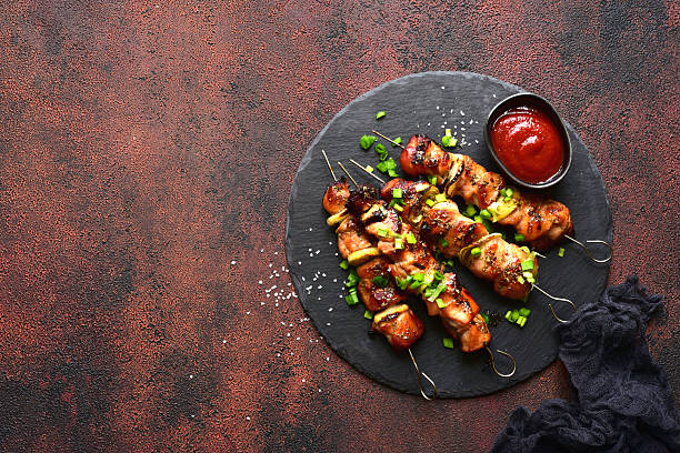 istock Roasted chicken skewer kebab. Top view with copy space. 2232269055