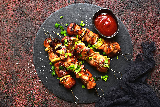 istock Roasted chicken skewer kebab. Top view with copy space. 2232269058