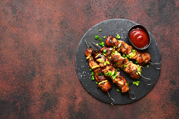 istock Roasted chicken skewer kebab. Top view with copy space. 2232269059