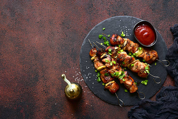 istock Roasted chicken skewer kebab. Top view with copy space. 2232269061