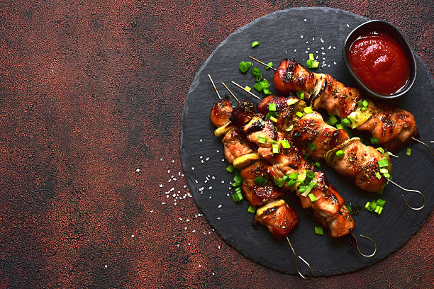 istock Roasted chicken skewer kebab. Top view with copy space. 2232269069