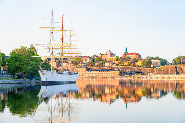 istock Sailing ship reflecting on calm water with stockholm skyline in background 2232271314