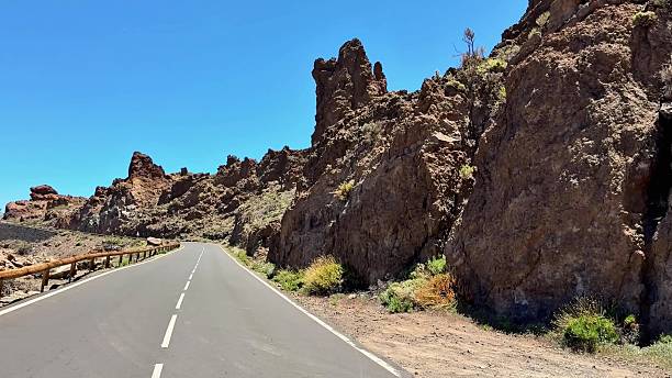 istock A scenic road winds through a dramatic landscape, perfect for exploration and adventure 2232271456