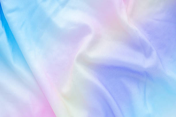 istock Abstract colorful rainbow color fabric soft wave smooth texture surface background 2232275636
