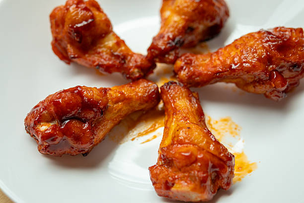 istock Grilled spicy chicken wing on white plate 2232276017