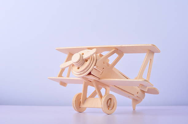 Wooden toy airplane on white background