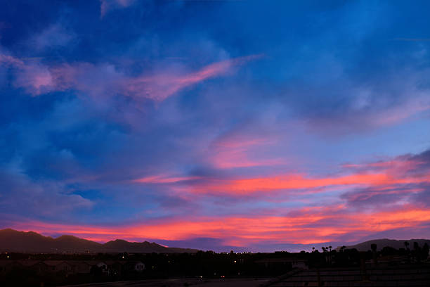 istock Illuminated Clouds at Sunset over Desert City 2232286370