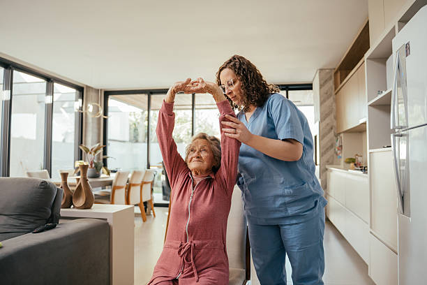 istock Elderly patient undergoing physical therapy - home consultation 2232288738