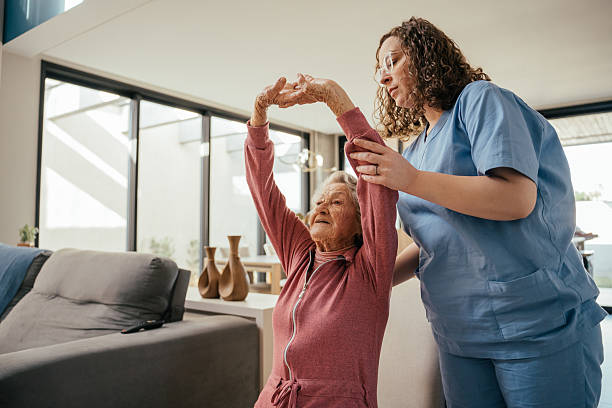 istock Elderly patient undergoing physical therapy - home consultation 2232288739