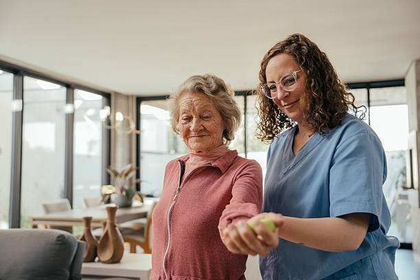 istock Elderly patient undergoing physical therapy - home consultation 2232288757