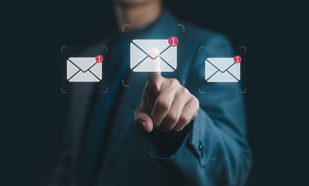 istock Businessman touching virtual screen with new email notification icons, symbolizing digital communication, online inbox, electronic messaging, internet connectivity, business mail, and mobile technology. 2232289149