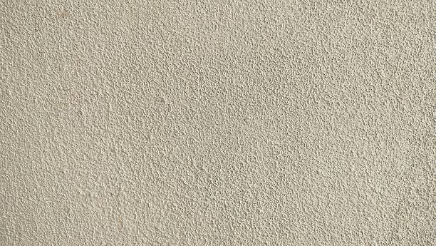 istock Warm white concrete cement background with subtle beige or cream undertones. light beige or off-white textured wall with a slightly rough surface 2232290491