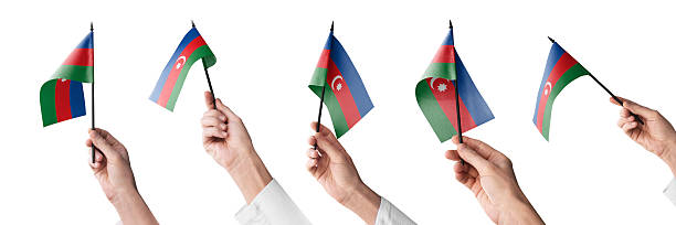 The Azerbaijan flag in hand in different angles on a white background.