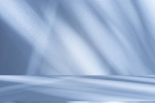 istock Studio style background wall decoration presentation uses white and blue tones. with shadows cast from a nearby window, concept creating a decorative 2232294964