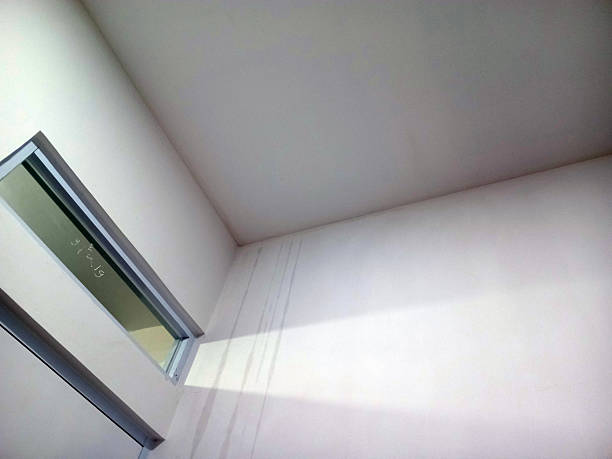 Minimalist interior with white walls and window