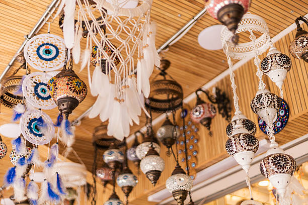 istock Various handmade ornaments and decorations dangle from the ceiling, displaying intricate designs and vibrant colors in a lively marketplace that celebrates local craftsmanship 2232315543