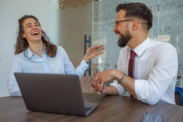 istock Business people laughing together during a meeting 2232315871