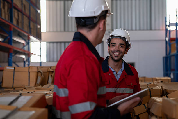 istock The staff is working in the office document storage area. The warehouse workers are checking the stock on the shelves in the production department. 2232316958