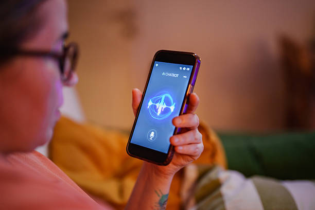 istock Woman using chatbot voice assistant on smartphone at home 2232317905