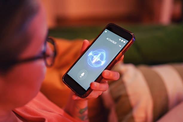istock Woman using chatbot voice assistant on smartphone at home 2232318749