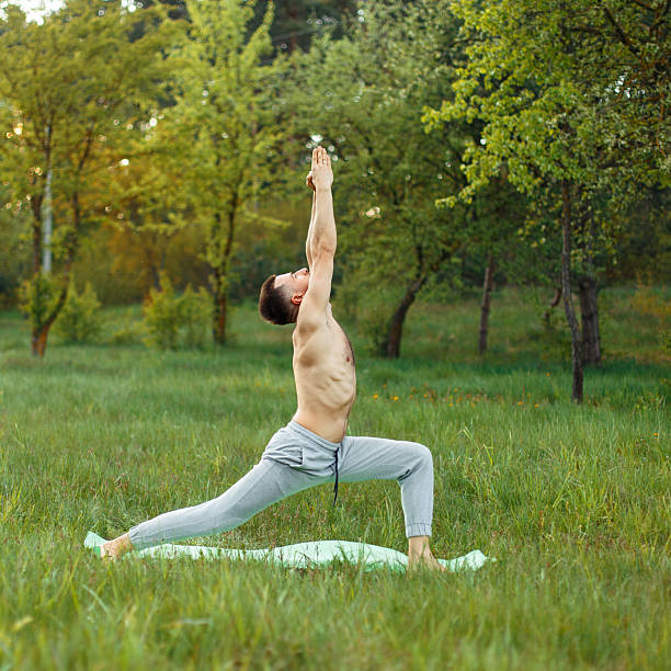 istock Man doing yoga outdoors 2232319887