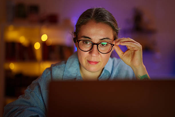 istock Woman working late on laptop at home office 2232319912