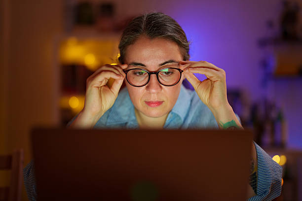 istock Woman working late on laptop at home office 2232320014