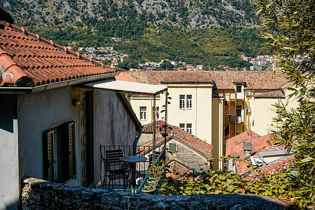 High-angle shot showing red rooftops and balconies in Kotor Old Town, Montenegro.
