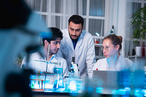 istock A group of young scientists are conducting experiments in the lab using a microscope., Aspiring scientists are busy running laboratory experiments 2232320223