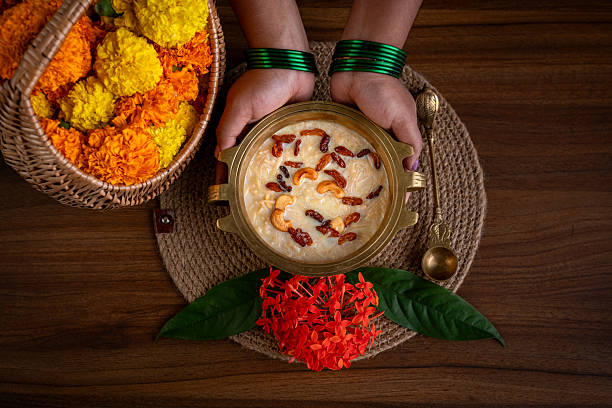 istock Women’s hands serving  delicious traditional Onam payasam. 2232320480