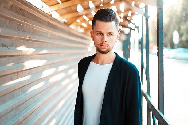 istock Handsome successful man in stylish clothes walking on a sunny day 2232320976