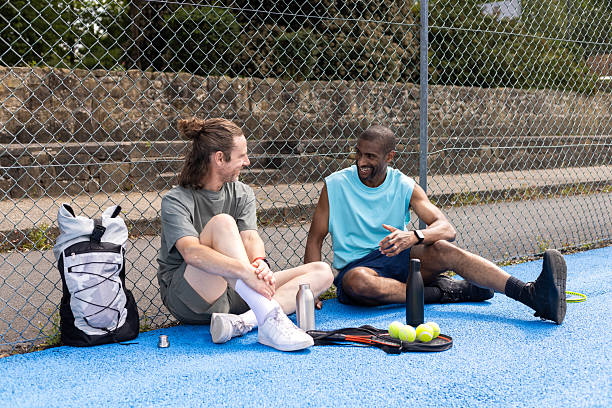 istock Friends Catching Up Before Playing Tennis 2232324771