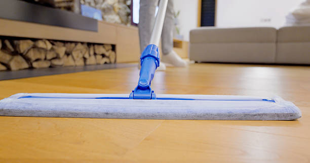 istock Flat Microfiber Mop Cleaning Light Wood Floor in Modern Living Room 2232326049