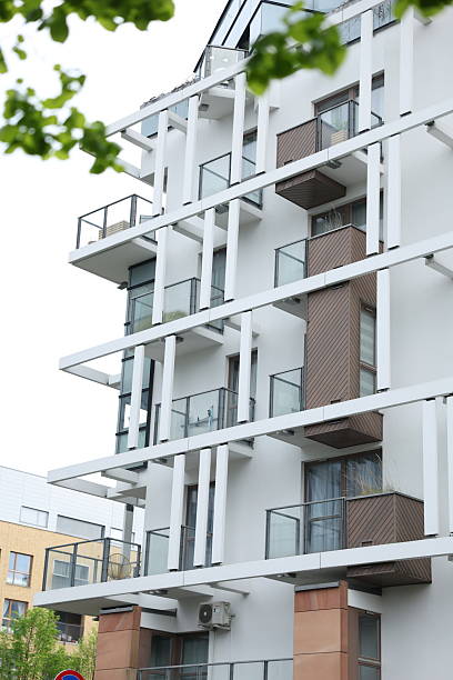 istock Low-angle view of a modern apartment building's exterior. 2232327150