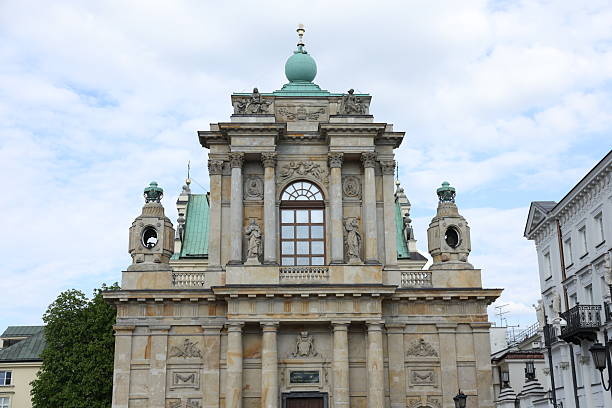 Elegant Baroque-style building facade, detailed stonework, classical columns, and statues.  Serene mood, perfect for travel, architecture, and historical context. Ideal for tourism, real estate, and heritage projects.