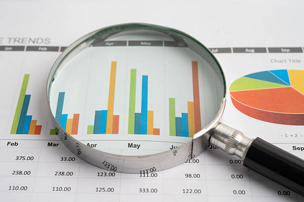 istock Magnifying glass on charts graphs paper. Financial development, Banking Account, Statistic, Investment Analytic research data economy. 2232327564