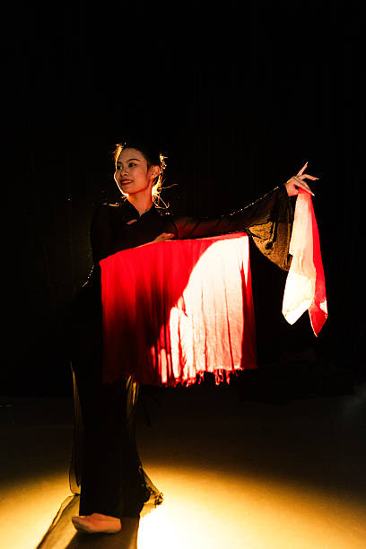 istock The girl dancing under the stage lights 2232327851