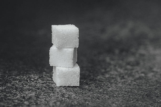 Sugar cubes on wooden