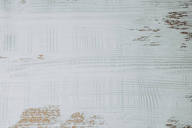 Textured white surface with subtle golden accents enhancing visual interest
