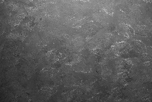 istock Dark gray wall with grunge texture and detailed plaster surface 2232329703